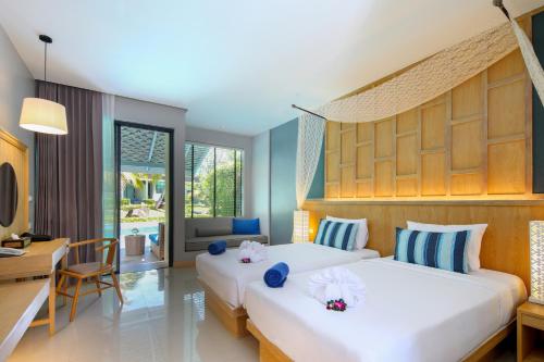 Postel nebo postele na pokoji v ubytování CRAFT Resort & Villas, Phuket Town