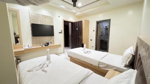 Ένα ή περισσότερα κρεβάτια σε δωμάτιο στο Hotel Jia International