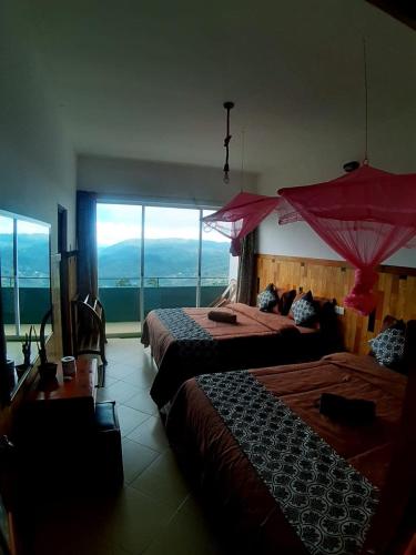 Ένα ή περισσότερα κρεβάτια σε δωμάτιο στο Polo Region Rest Inn