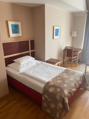Postel nebo postele na pokoji v ubytování EA Hotel Julis