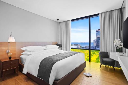 Postel nebo postele na pokoji v ubytování Marriott Executive Apartments Port Moresby