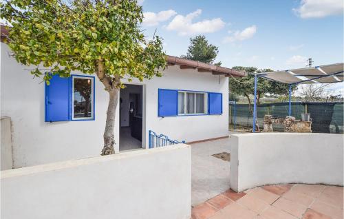 a house with a tree in front of it at Gorgeous Home In Vittoria With Wifi in Vittoria