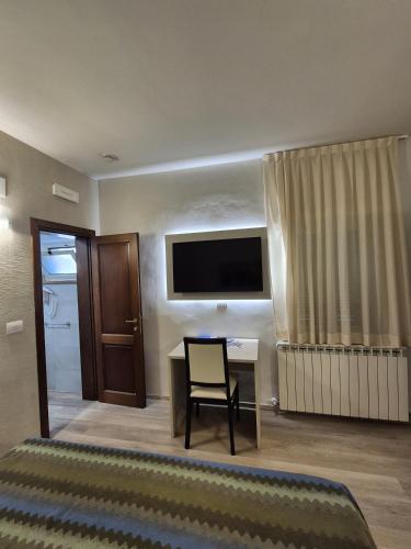 Μια τηλεόραση ή/και κέντρο ψυχαγωγίας στο Hotel Bellavista
