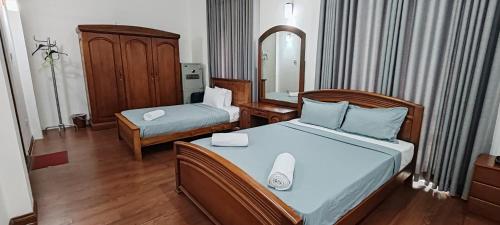 Una cama o camas en una habitación de Jays Guest Diyatha Waterfront