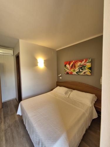 Ένα ή περισσότερα κρεβάτια σε δωμάτιο στο Hotel Bellavista