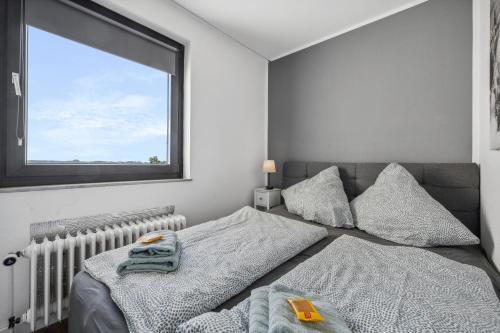 Giường trong phòng chung tại Fräulein Paula - Steinhude