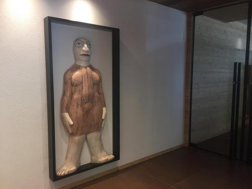 a statue of a man in a frame on a wall at Fedaia Joy B&B in Canazei