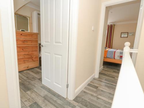 a room with a door leading to a bedroom at Home From Home in Portland