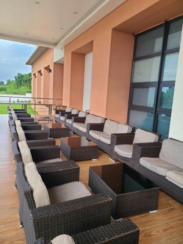 a row of chairs and tables in a building at Agulu Lake Resort and Conference Centre in Ekwulobia