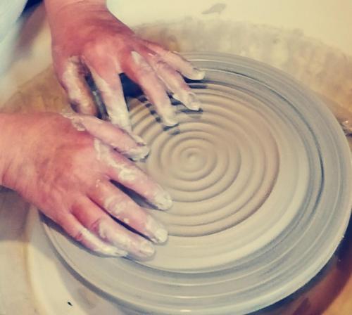 a person making a pot on a pottery wheel at La Solana, alojamiento y alfarería in Arenas de San Pedro