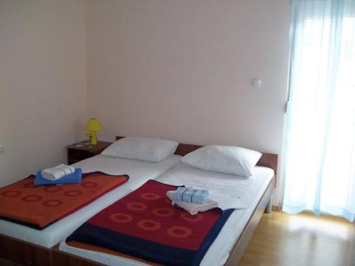 Postel nebo postele na pokoji v ubytování D & J Pansion