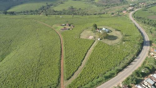an aerial view of a road in a field at KaChai Hotel Fort Portal in Kyarusozi