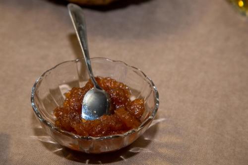 a glass bowl of food with a spoon in it at Fish Hotel in Akhalk'alak'i