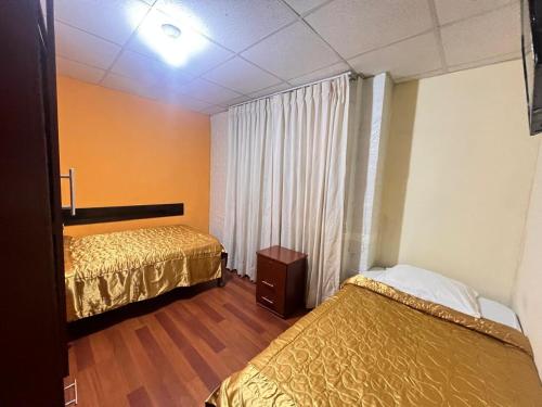 Ένα ή περισσότερα κρεβάτια σε δωμάτιο στο Hostal Orosheam