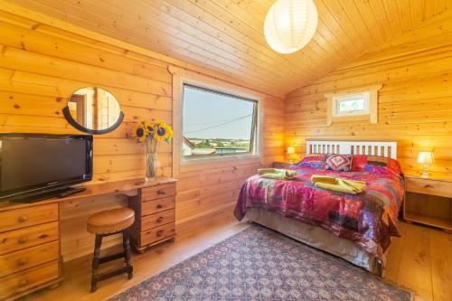 Postel nebo postele na pokoji v ubytování The Lodge