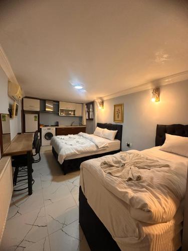 Postel nebo postele na pokoji v ubytování AWWA APART HOTEL