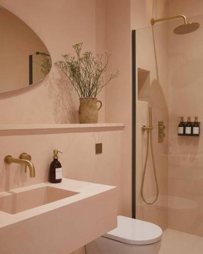 a bathroom with a toilet and a sink and a shower at Yarn - Arlo Deluxe Suite in Ballycastle