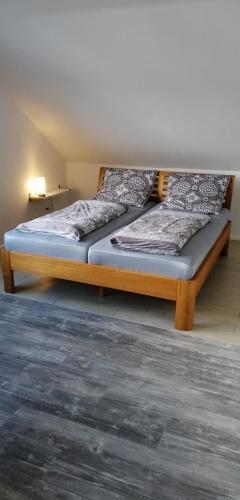 a bed in a room with two bedsitures at Ferienwohnung Kreuder in Bergisch Gladbach