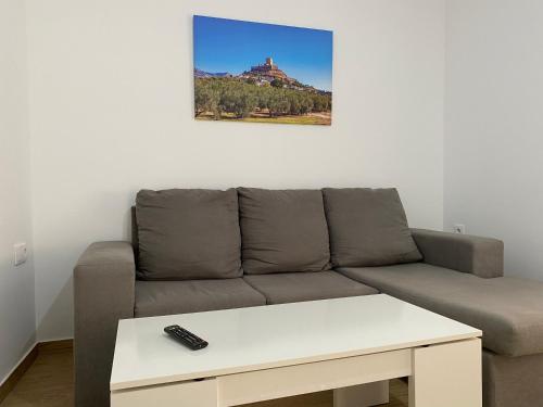 a living room with a couch and a table at El Olivo in Alcaudete