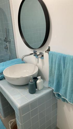 a bathroom with a sink and a mirror at Casa Veientana in Labaro