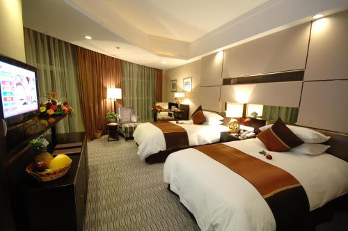 Katil atau katil-katil dalam bilik di Royal Palace Hotel Haining