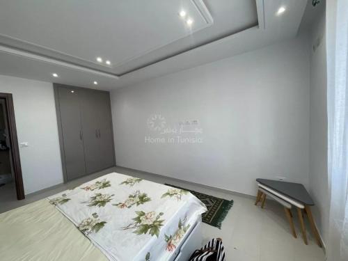 a room with a bed and a sign on the wall at Location saisonniere S1 a Tantana in Kasnadar