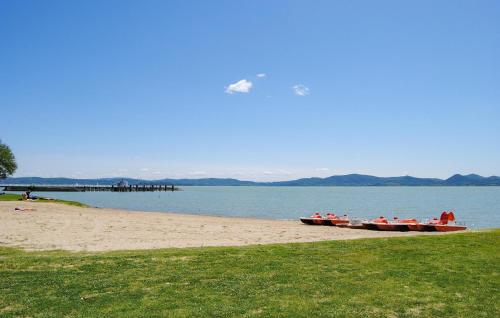 two boats sitting on the shore of a beach at Awesome Apartment In Castel Rigone in Castel Rigone