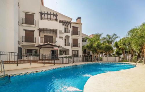 a swimming pool in front of a building at Gorgeous Apartment In Itrabo With Wifi in Ítrabo