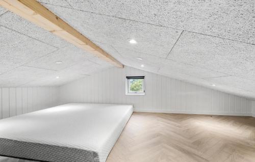 a white bed in a room with a ceiling at Lovely Home In Haderslev With Wifi in Haderslev
