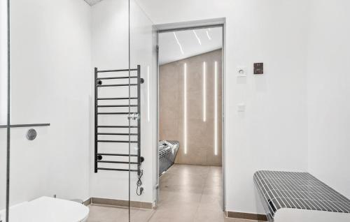 a bathroom with a glass door leading to a bedroom at Lovely Home In Haderslev With Wifi in Haderslev