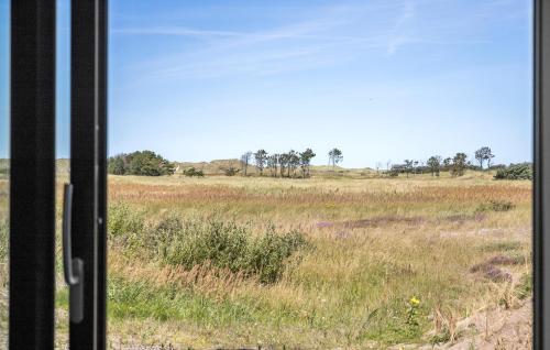 a view of a field from a train window at 3 Bedroom Nice Home In Skagen in Skagen