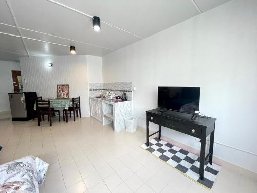 a living room with a piano and a dining room at Lively Impact C3-C9 in Nonthaburi