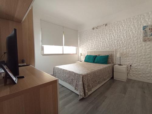 Katil atau katil-katil dalam bilik di Apartamento una habitación supercéntrico