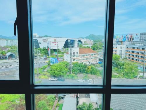 a view of a city from a window at 47near Shopping Malls and Naka night market in Phuket Town