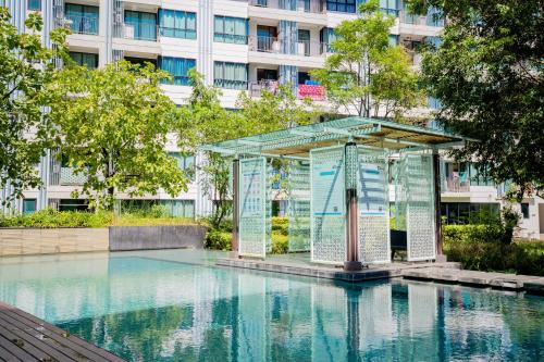 a cage in the middle of a pool of water at 04near Shopping Malls and Naka night market in Phuket Town