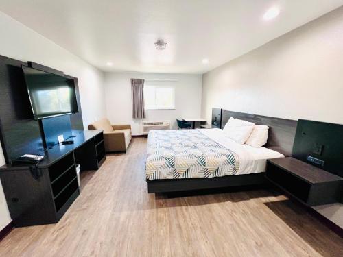 a hotel room with a bed and a television at Motel 6 Bullhead City, Az - Laughlin in Bullhead City