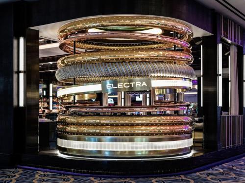 a building with a stack of shiny gold chains at The Venetian Resort Las Vegas By Suiteness in Las Vegas