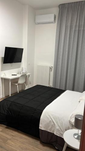 Business Home Piazza Cesare Battisti B&B Residenceにあるベッド