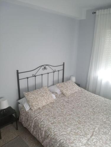 En eller flere senge i et værelse på Lugar de Figaredo