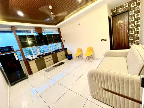 a living room with a couch and two chairs at #1BHK Studio Apartment with 3-4 person occupancy Family only in Mangalore