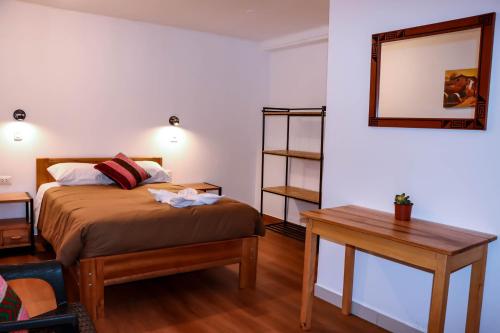 Cama o camas de una habitación en Andes House Cusco