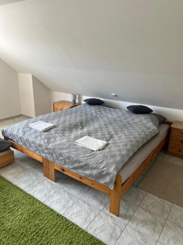 a bedroom with a large bed in a room at Ubytování na Čechách in Děčín