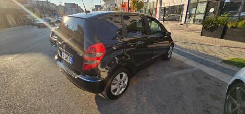 a black car parked on the side of a street at Tirana Apartment KDK in Tirana
