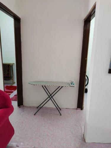 a table in the corner of a room at Homestay Kota Bharu in Kota Bharu