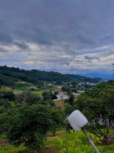a view of a valley with a street light at M Lapin - Hotel & Glamping near Antigua Guatemala in Antigua Guatemala