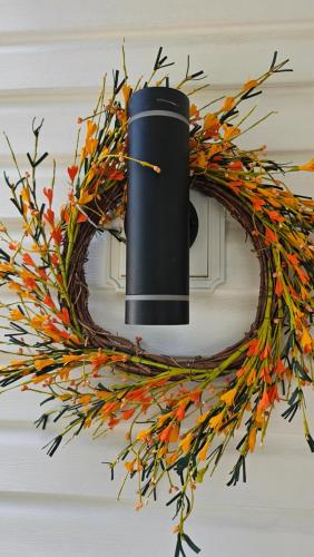 a wreath with autumn leaves on a door at Serenity Inn in Niagara Falls