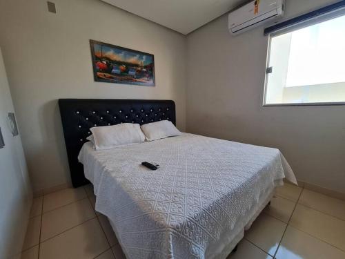 Postel nebo postele na pokoji v ubytování Kitnet 102, confortável, central, com ar, tv smart