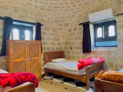 Ένα ή περισσότερα κρεβάτια σε δωμάτιο στο Zad Elmosafer Villa - Tunis Village
