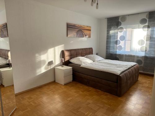 a small bedroom with a bed and a window at Ferienwohnung Petry in Clausen