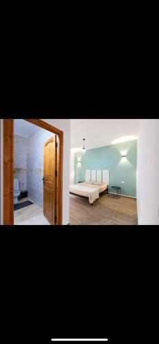 two pictures of a bedroom with a bed in a room at VILLA DAR EMNA in Hanshīr Qaşr Ghallāb